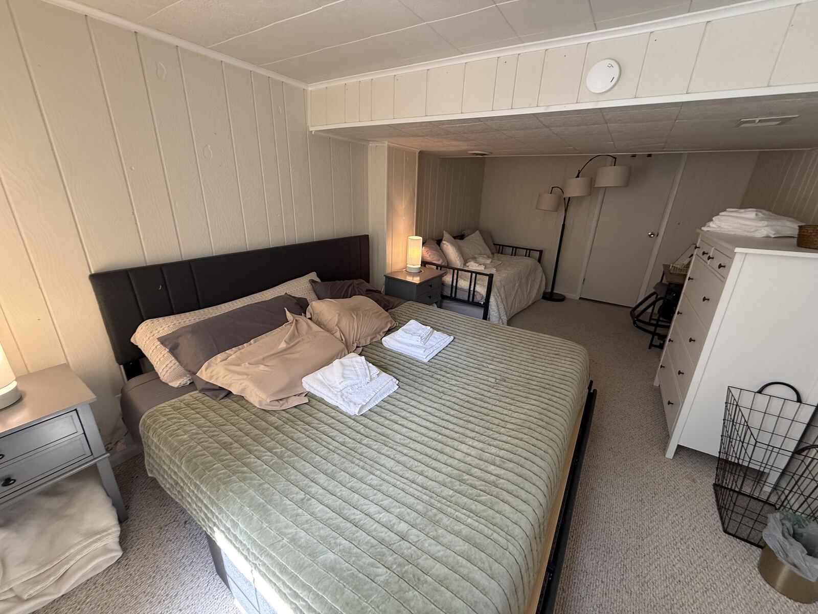 Third bedroom with king bed and twin day beds, sleeps travel nurse roommates