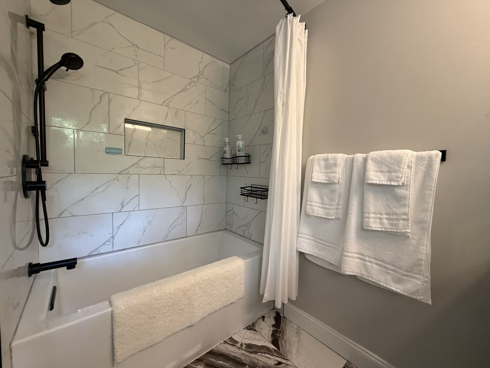 Luxury bathroom with soaking bathtub and heated floors