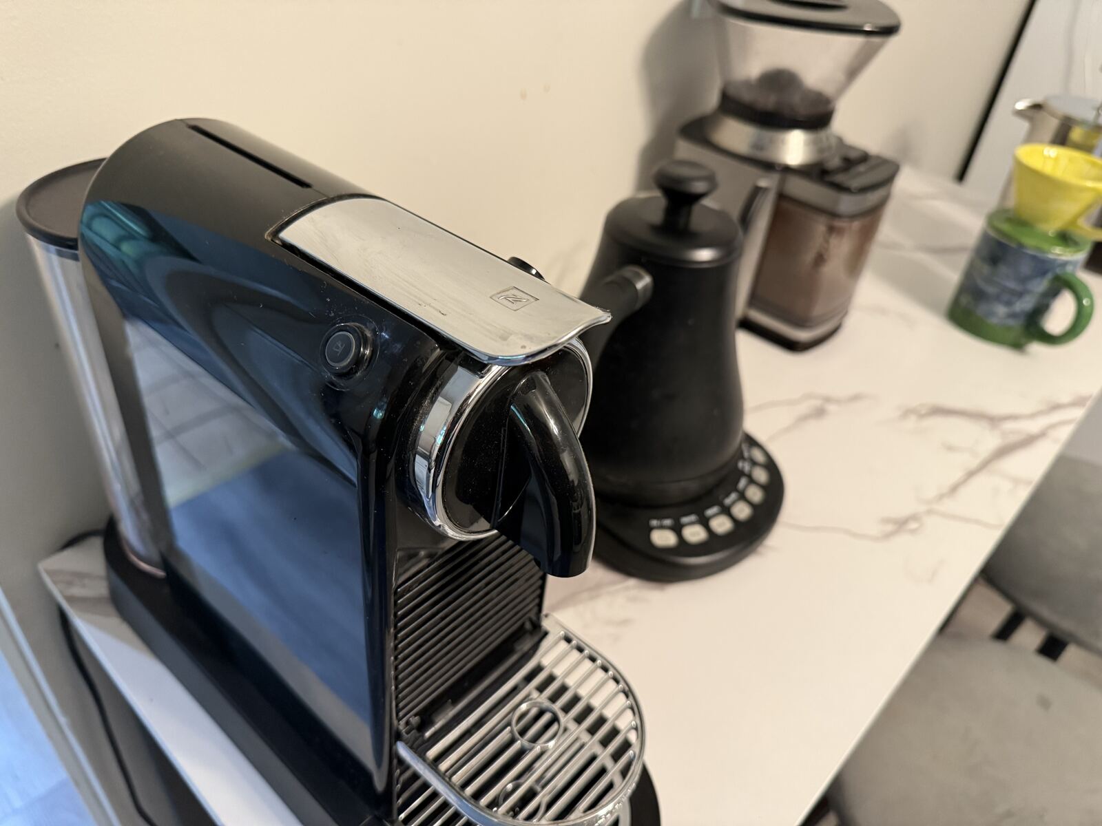 Coffee bar with Nespresso, French press and grinder in gourmet kitchen