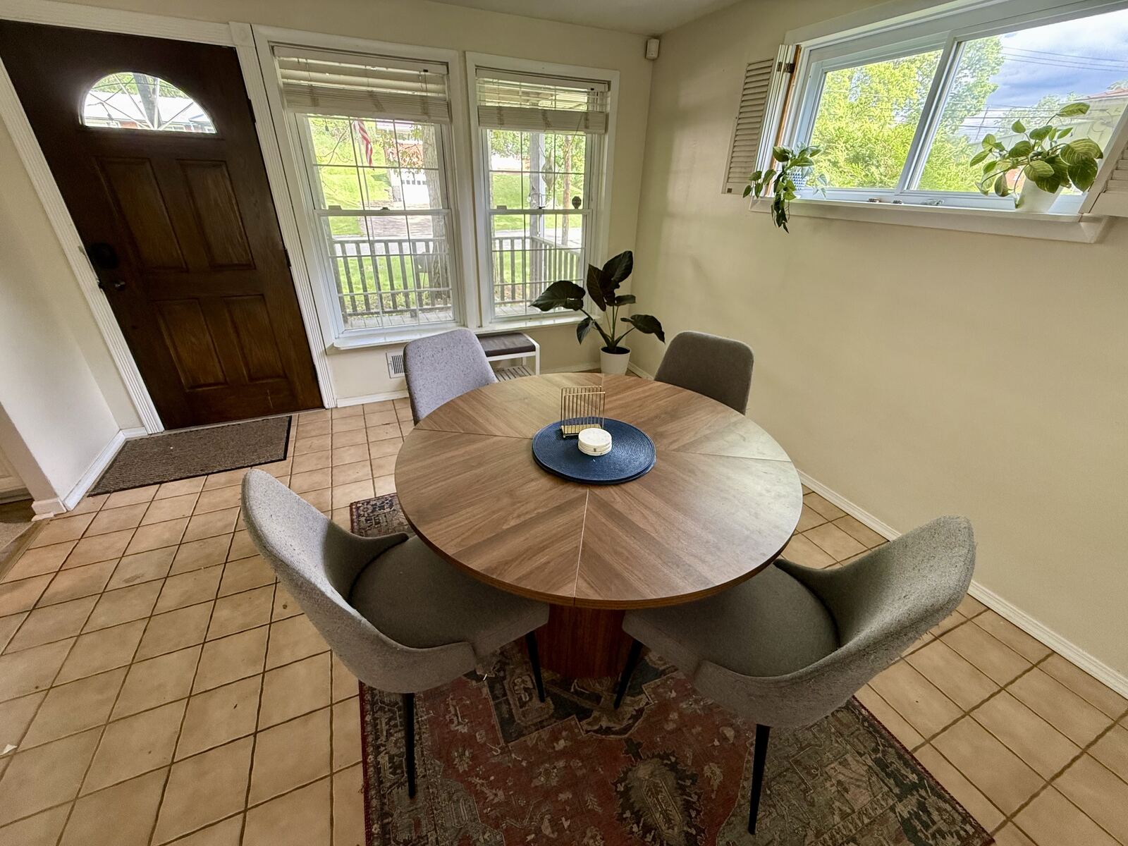 Dining table and living area of furnished monthly rental Pittsburgh